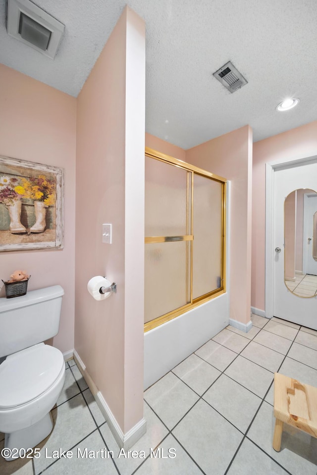 1258 Watson St, Alexander City, AL 35010 - full bathroom featuring enclosed tub / shower combo, tile patterned floors, a textured ceiling, and recessed lighting