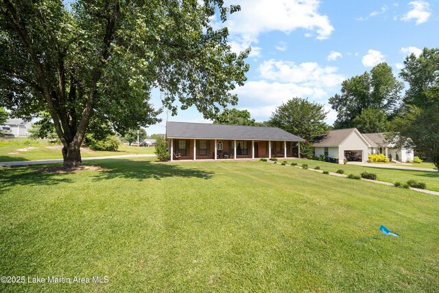 1258 Watson St, Alexander City, AL 35010 - view of front of property with a front lawn and a porch