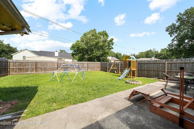 1258 Watson St, Alexander City, AL 35010 - fenced backyard with a playground and a patio area