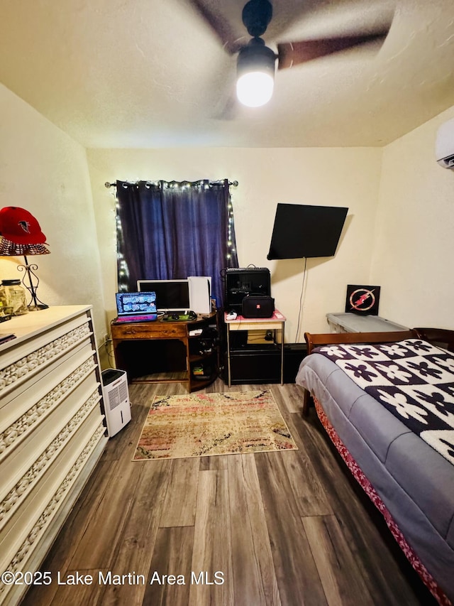 bedroom featuring dark wood-type flooring and ceiling fan