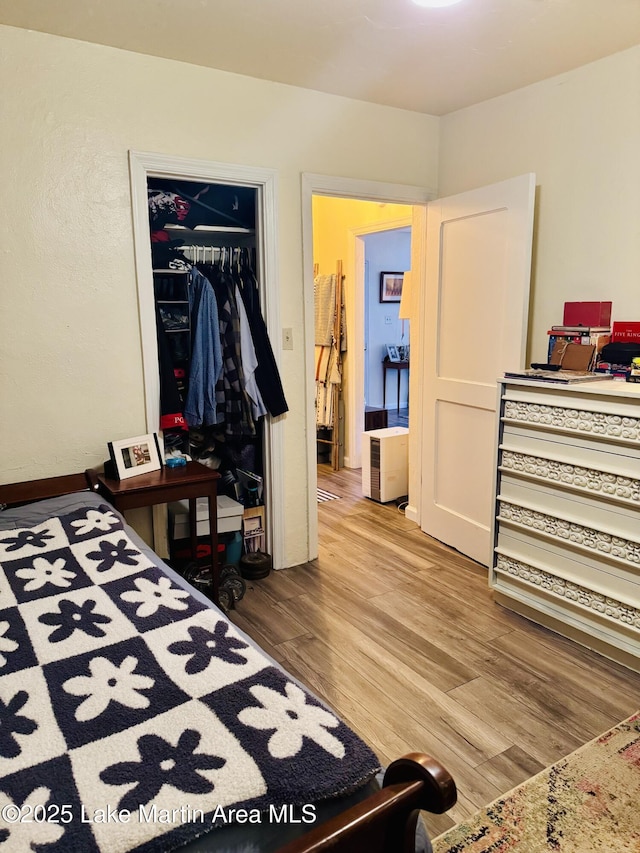 bedroom with wood-type flooring