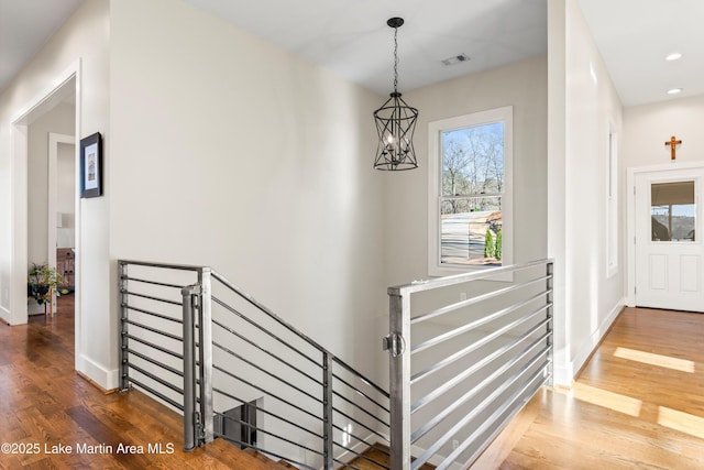2082 River Oaks Dr, Jacksons Gap, AL 36861 - corridor with an upstairs landing, plenty of natural light, wood finished floors, and recessed lighting