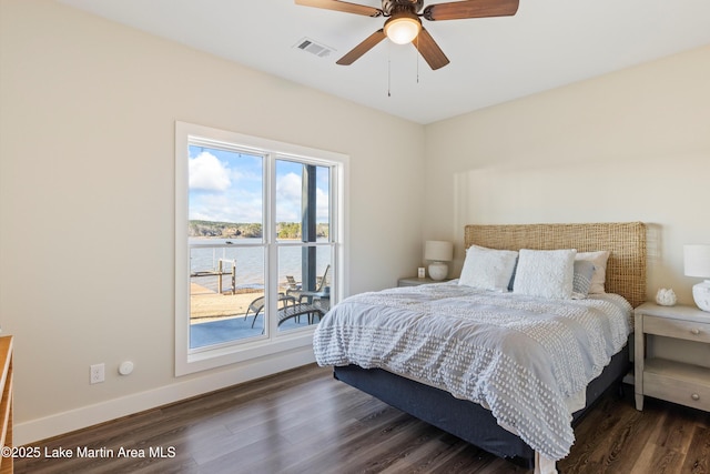 2082 River Oaks Dr, Jacksons Gap, AL 36861 - bedroom with a water view, wood finished floors, and ceiling fan