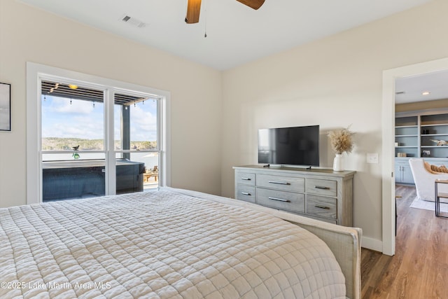 2082 River Oaks Dr, Jacksons Gap, AL 36861 - bedroom with wood finished floors and ceiling fan