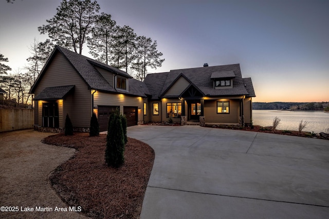2082 River Oaks Dr, Jacksons Gap, AL 36861 - view of front of property with concrete driveway, an attached garage, roof with shingles, and covered porch