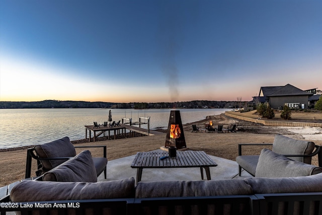 2082 River Oaks Dr, Jacksons Gap, AL 36861 - view of patio with a water view and an outdoor living space with a fire pit