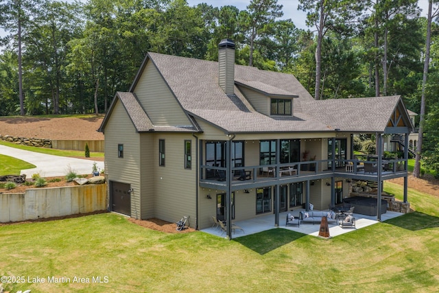 2082 River Oaks Dr, Jacksons Gap, AL 36861 - back of property featuring an outdoor living space, a patio area, a yard, a chimney, and roof with shingles
