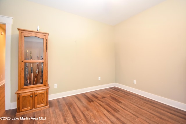 120 Rocky Creek Dr, Alexander City, AL 35010 - empty room with dark wood-style floors and baseboards