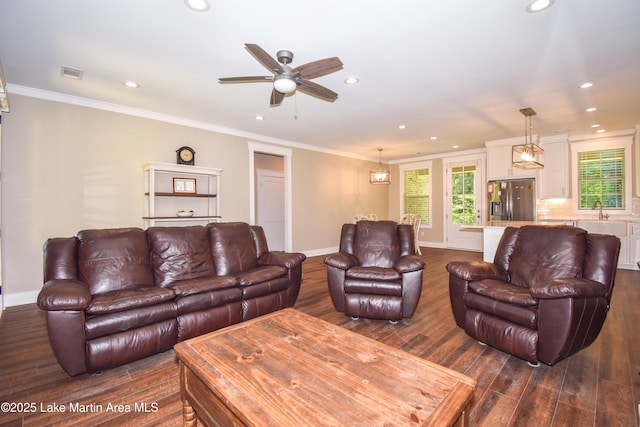 120 Rocky Creek Dr, Alexander City, AL 35010 - living room featuring dark wood finished floors, recessed lighting, a ceiling fan, plenty of natural light, and crown molding