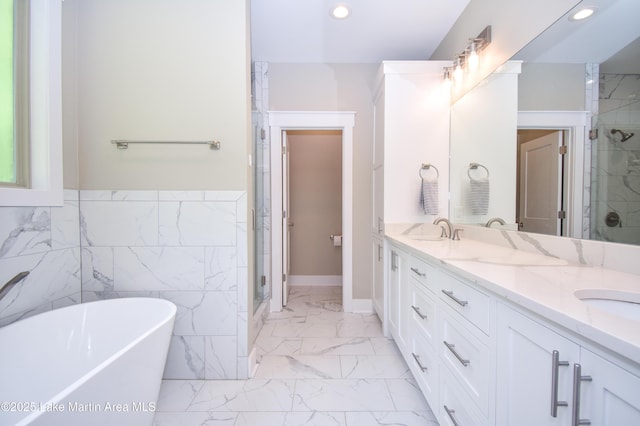 120 Rocky Creek Dr, Alexander City, AL 35010 - full bathroom featuring marble look tile flooring, double vanity, a freestanding tub, a shower stall, and recessed lighting
