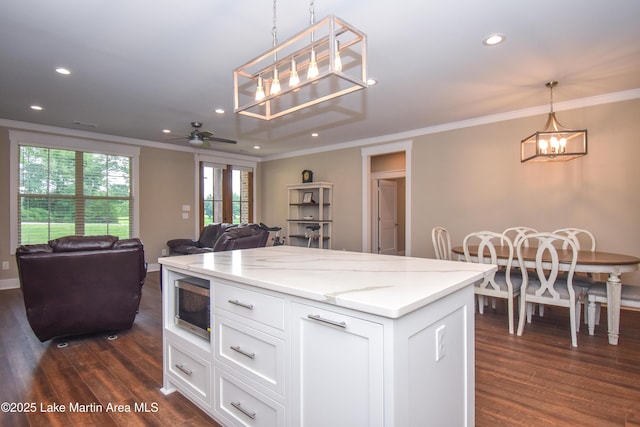 120 Rocky Creek Dr, Alexander City, AL 35010 - kitchen with stainless steel microwave, ornamental molding, a chandelier, a ceiling fan, and recessed lighting