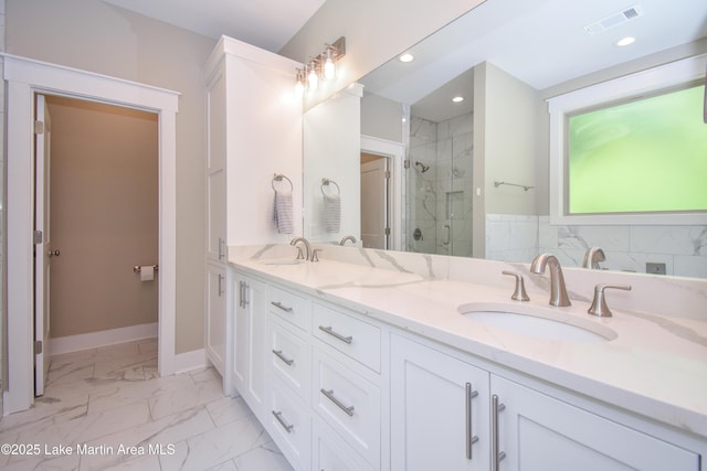 120 Rocky Creek Dr, Alexander City, AL 35010 - bathroom featuring double vanity, marble look tiles, a shower stall, and recessed lighting