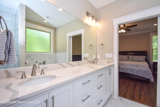 120 Rocky Creek Dr, Alexander City, AL 35010 - full bath with double vanity, a ceiling fan, marble finish flooring, and ensuite bathroom