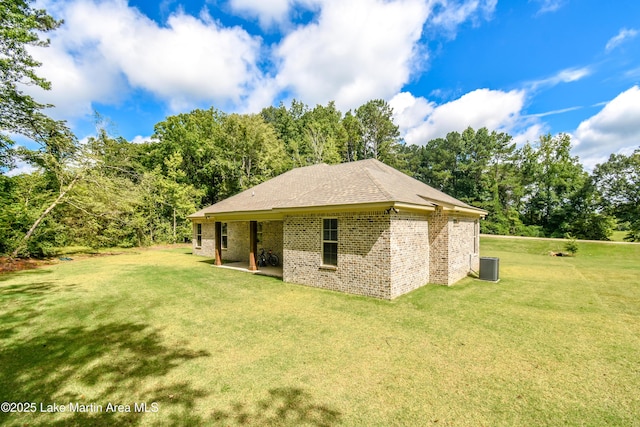 120 Rocky Creek Dr, Alexander City, AL 35010 - view of side of home with a lawn, brick siding, and a patio