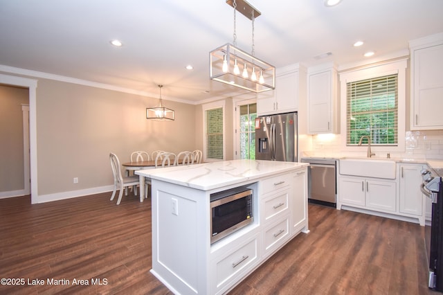 120 Rocky Creek Dr, Alexander City, AL 35010 - kitchen featuring appliances with stainless steel finishes, white cabinetry, decorative backsplash, recessed lighting, and ornamental molding