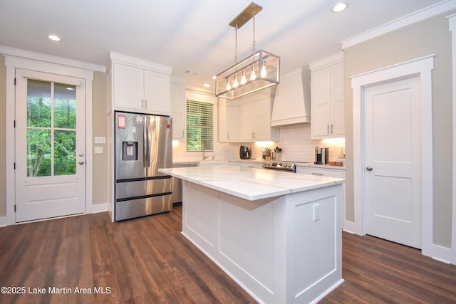120 Rocky Creek Dr, Alexander City, AL 35010 - kitchen with stainless steel appliances, premium range hood, white cabinets, decorative backsplash, and recessed lighting