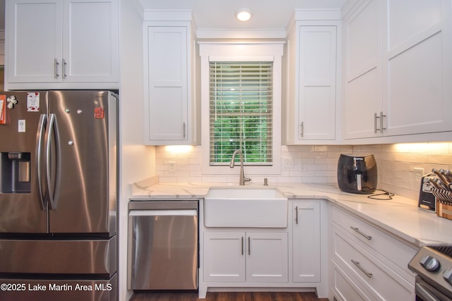 120 Rocky Creek Dr, Alexander City, AL 35010 - kitchen featuring stainless steel appliances, white cabinetry, tasteful backsplash, and light stone countertops