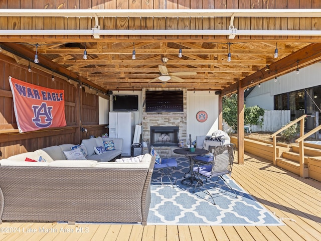 living room featuring hardwood / wood-style flooring and an outdoor stone fireplace