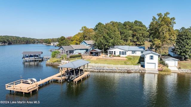 view of dock featuring a water view and a lawn