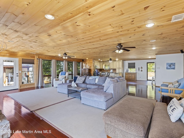 living room featuring wood-type flooring and wooden ceiling