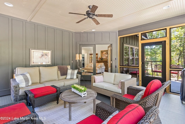 living room with ceiling fan and wood ceiling