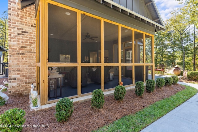 view of property exterior with a sunroom