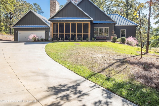 view of front of house featuring a front yard and a garage