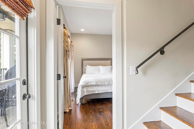 bedroom with hardwood / wood-style floors