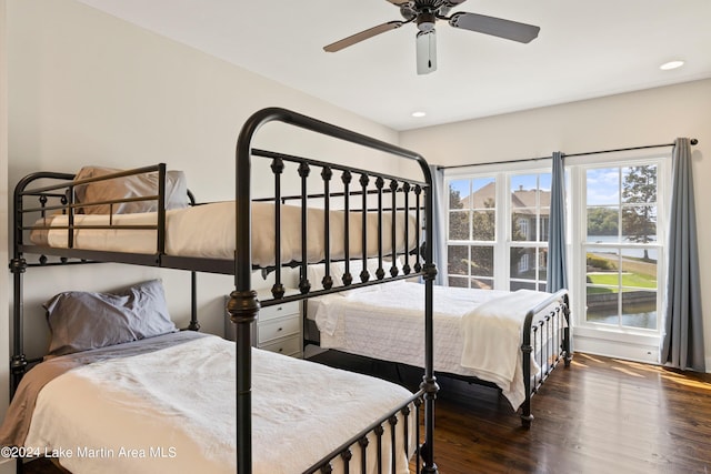 bedroom with ceiling fan and dark hardwood / wood-style floors