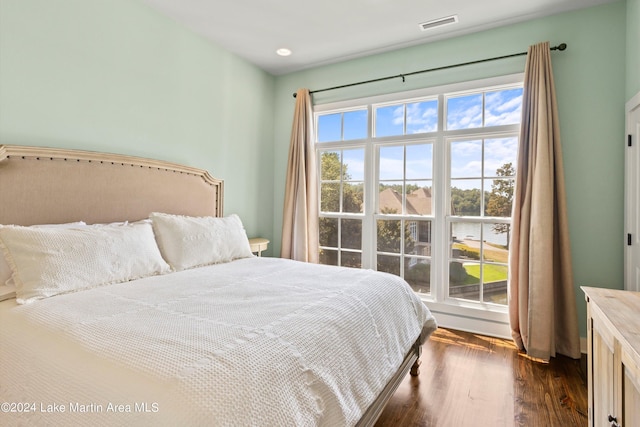 bedroom featuring dark hardwood / wood-style flooring