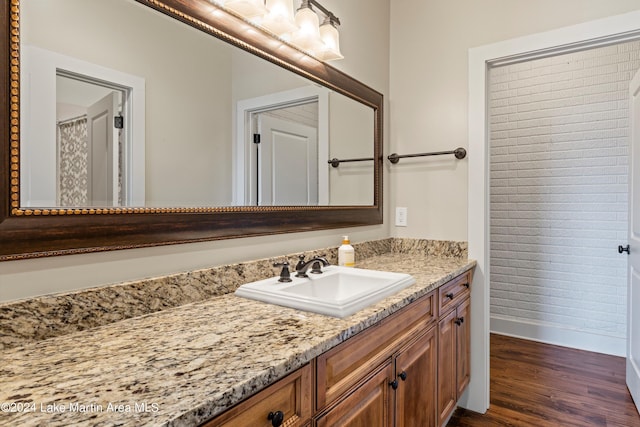 bathroom with wood-type flooring and vanity