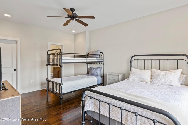 bedroom with ceiling fan and dark hardwood / wood-style floors