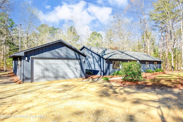 view of front of property with a garage and driveway