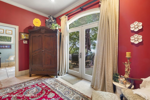 doorway to outside featuring crown molding, french doors, and light tile patterned floors