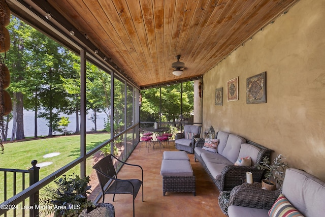 sunroom / solarium with a water view and wooden ceiling