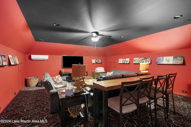 carpeted home theater room with a wall mounted air conditioner, ceiling fan, and lofted ceiling