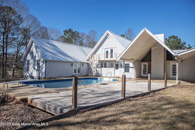 1676 Scott Rd, Alexander City, AL 35010 - back of property with french doors, metal roof, and an empty pool