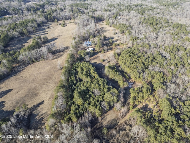 birds eye view of property with a forest view