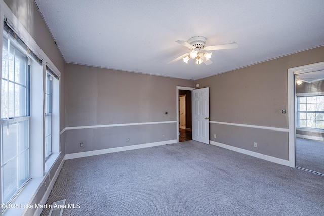 1676 Scott Rd, Alexander City, AL 35010 - unfurnished bedroom featuring carpet flooring, baseboards, and ceiling fan