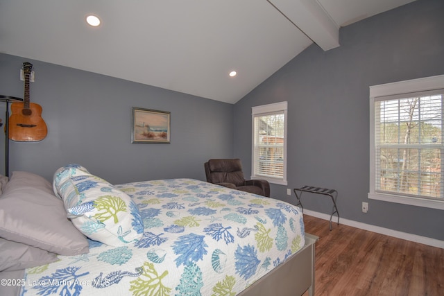 bedroom with hardwood / wood-style floors, lofted ceiling with beams, and multiple windows