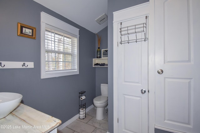 bathroom featuring toilet