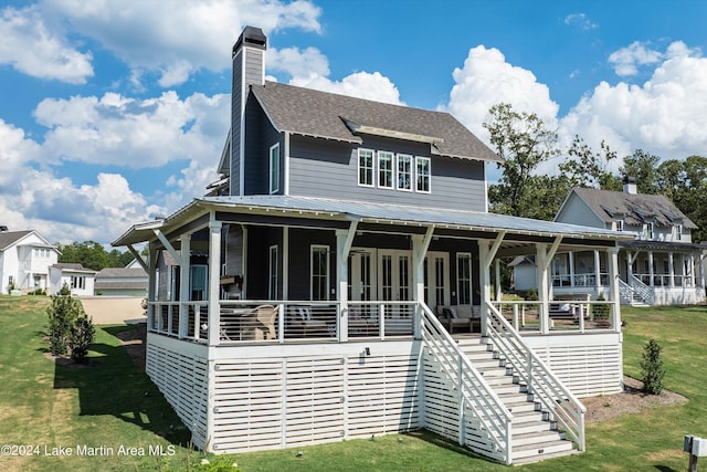 view of front of house with covered porch and a front yard