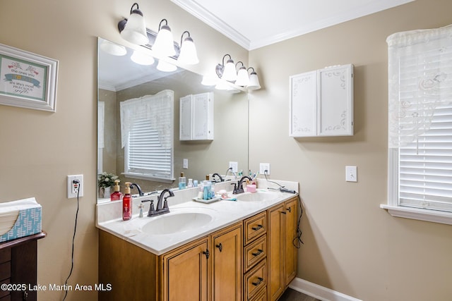 bathroom with double vanity, crown molding, and a sink