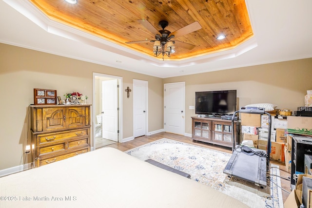 bedroom featuring baseboards, wood finished floors, a raised ceiling, and wood ceiling