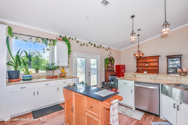 4869 County Road 2225, Troy, AL 36079 - kitchen featuring stainless steel dishwasher, light wood-style flooring, vaulted ceiling, ornamental molding, and french doors