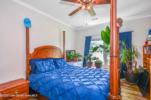 4869 County Road 2225, Troy, AL 36079 - bedroom with wood finished floors, crown molding, and a ceiling fan