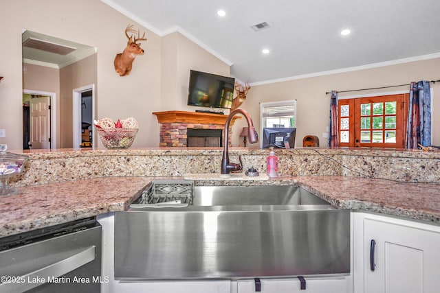 4869 County Road 2225, Troy, AL 36079 - kitchen with stainless steel dishwasher, a sink, crown molding, recessed lighting, and white cabinets