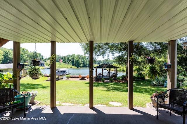 view of patio / terrace with a gazebo and a water view