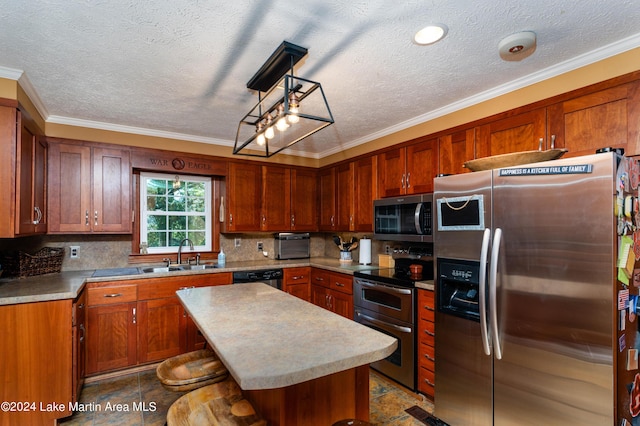 kitchen featuring stainless steel appliances, crown molding, sink, a center island, and hanging light fixtures