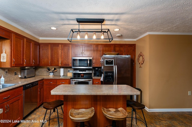 kitchen with a center island, crown molding, a kitchen bar, decorative backsplash, and appliances with stainless steel finishes